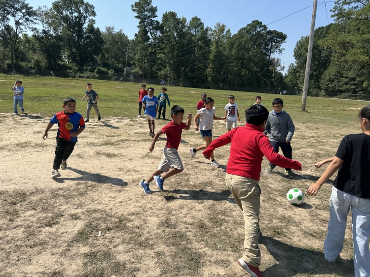 Playing soccer during recess