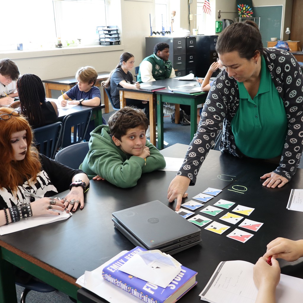 Students working together to organize cards
