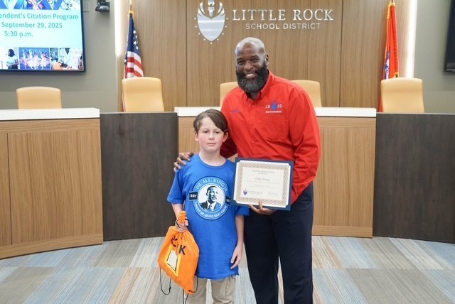 Photo of student and superintendent 