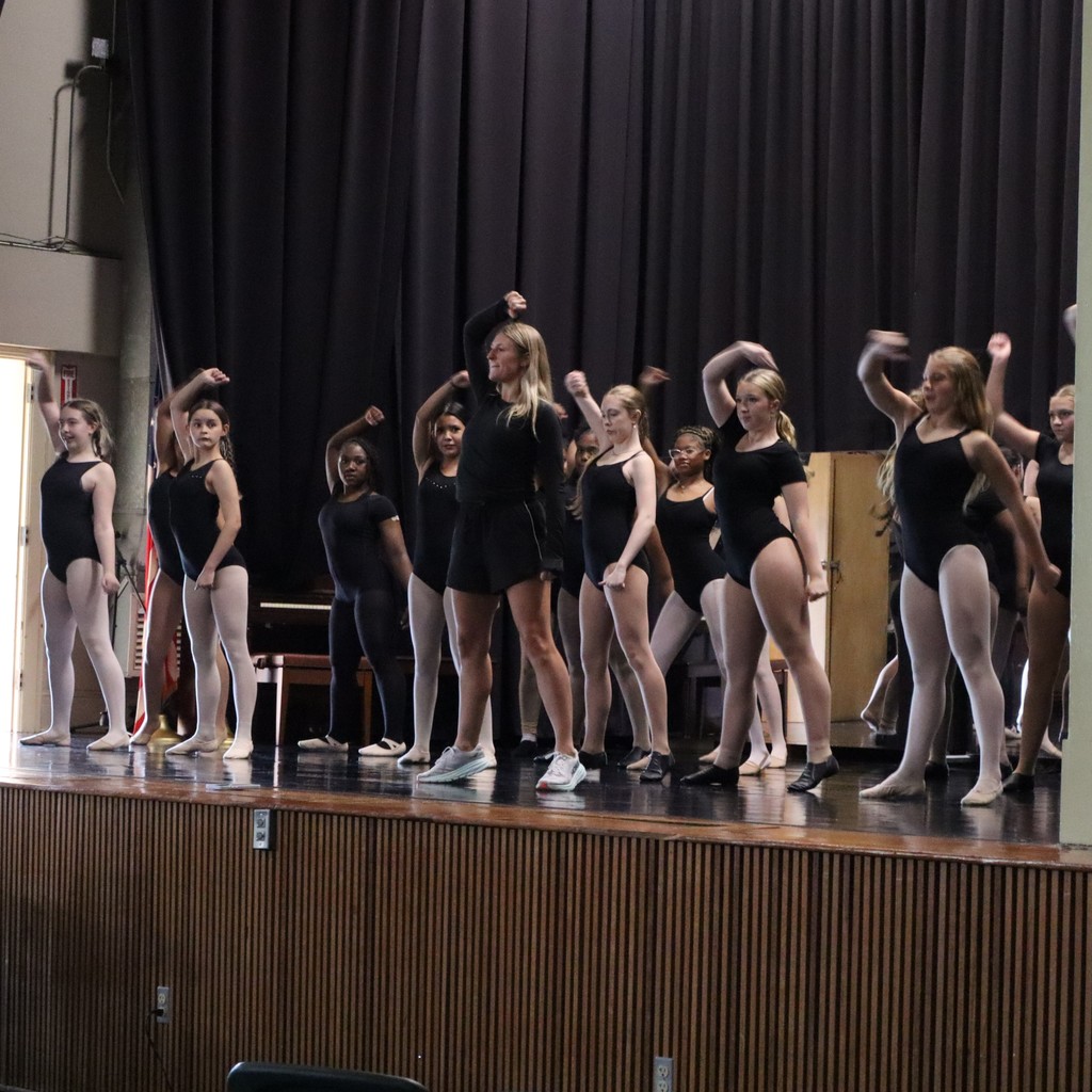 A group of students working on choreography with guest choreographer Ally Hopper.