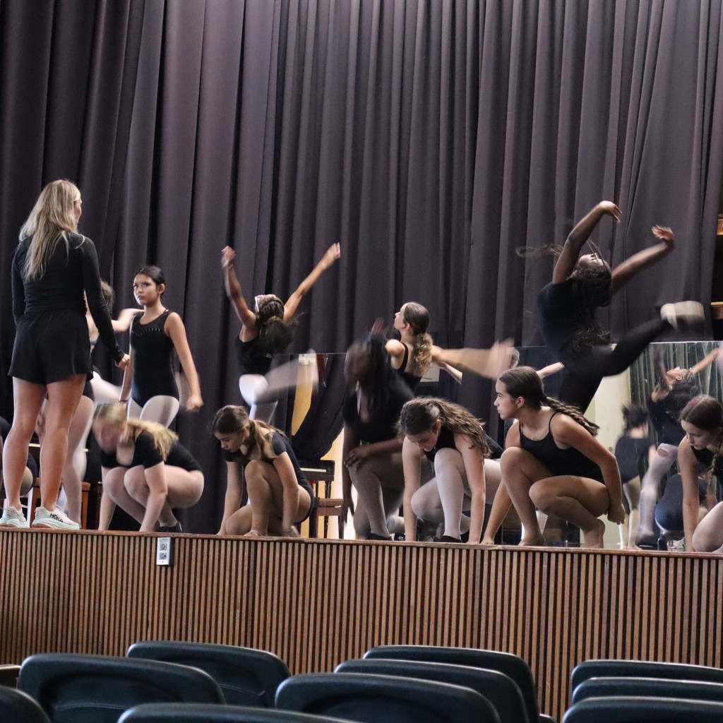 A group of students working on choreography with guest choreographer Ally Hopper.