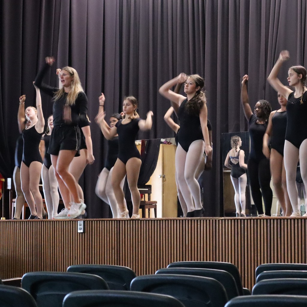 A group of students working on choreography with guest choreographer Ally Hopper.