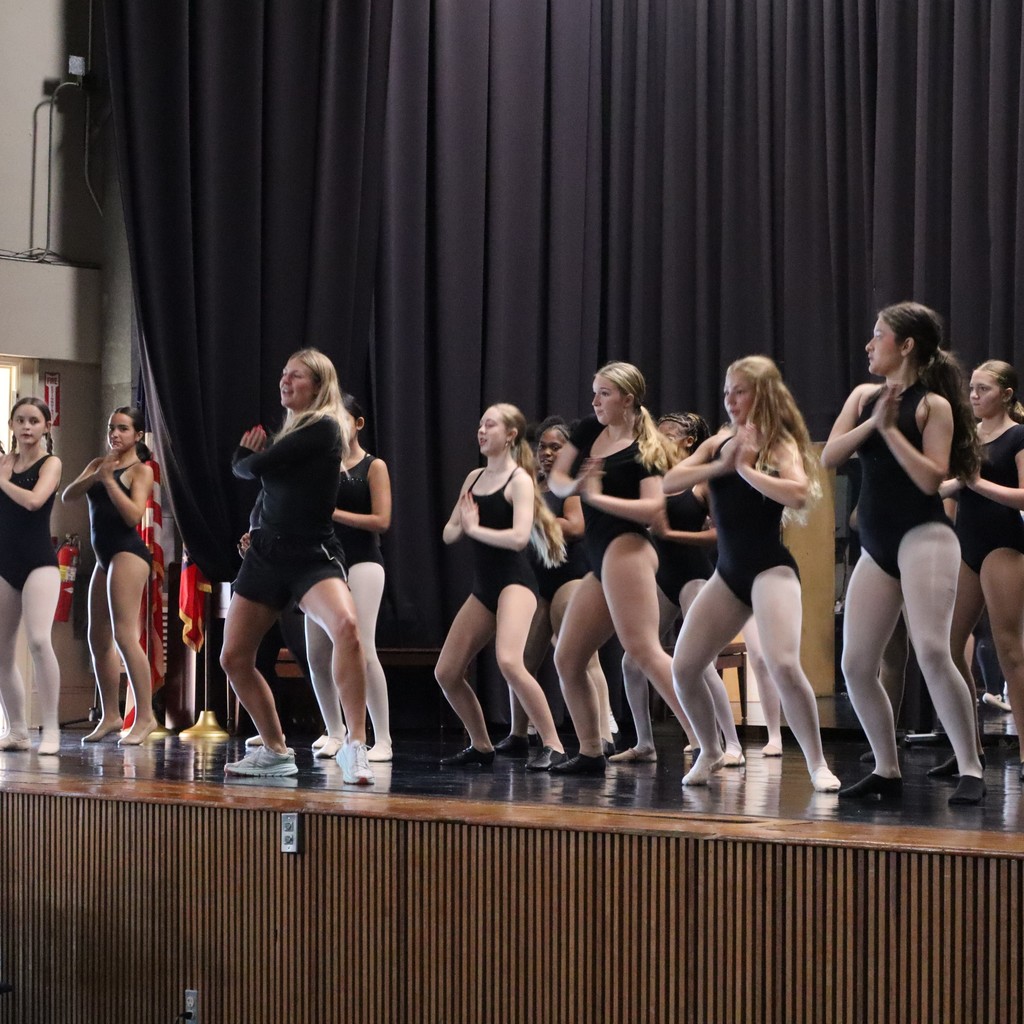 A group of students working on choreography with guest choreographer Ally Hopper.