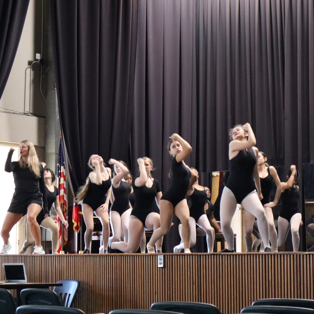 A group of students working on choreography with guest choreographer Ally Hopper.