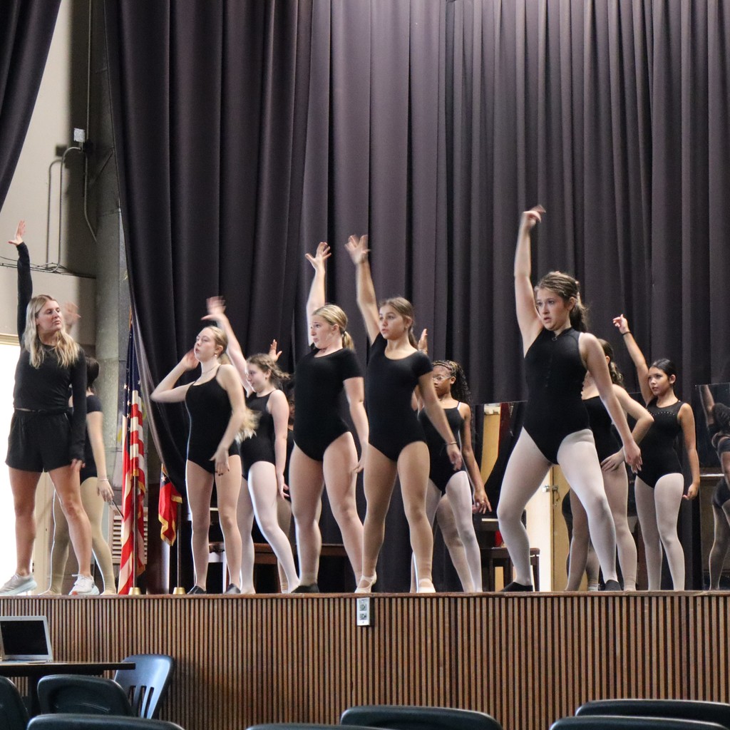 A group of students working on choreography with guest choreographer Ally Hopper.