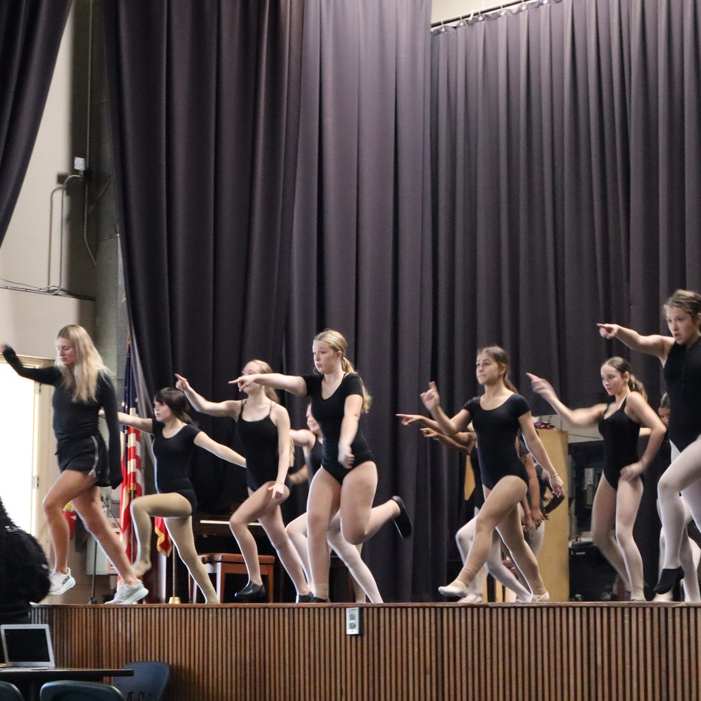 A group of students working on choreography with guest choreographer Ally Hopper.
