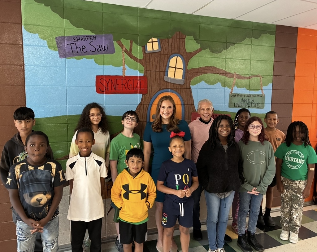 Groups picture of news anchor with the student news team