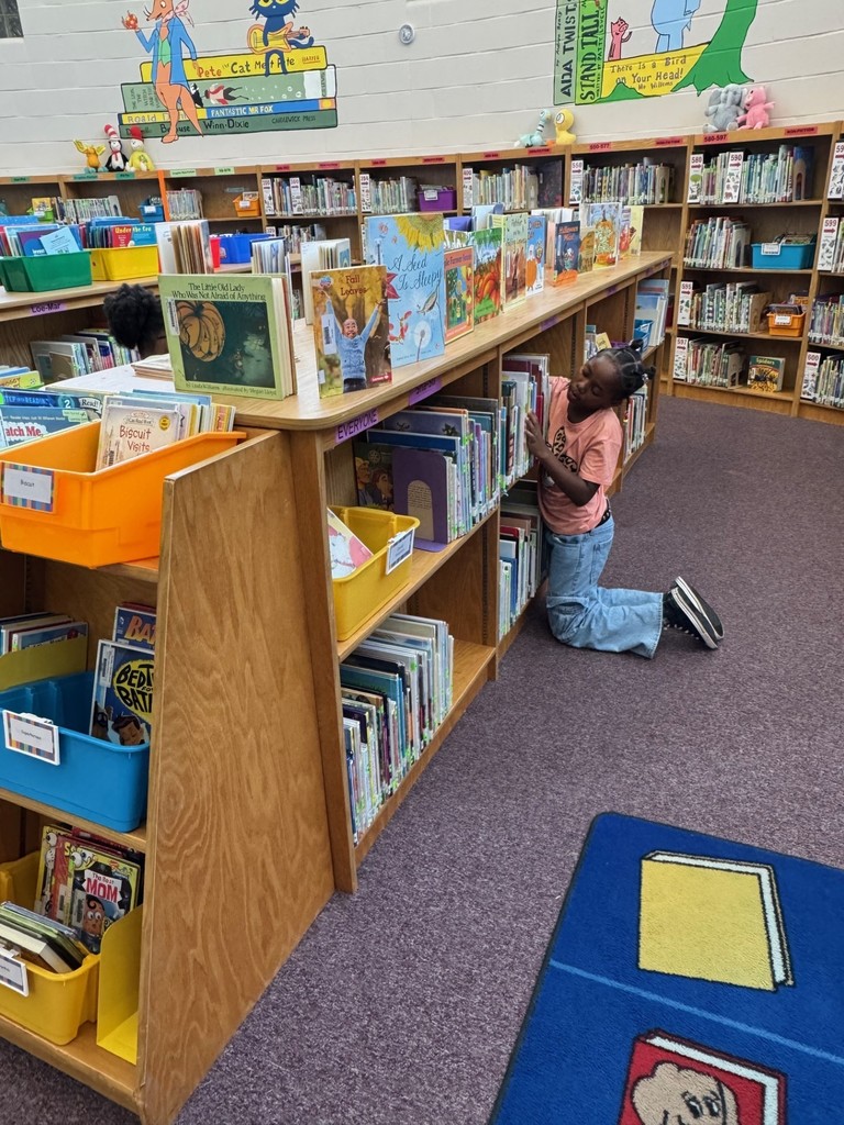 3rd Graders Shelving Books