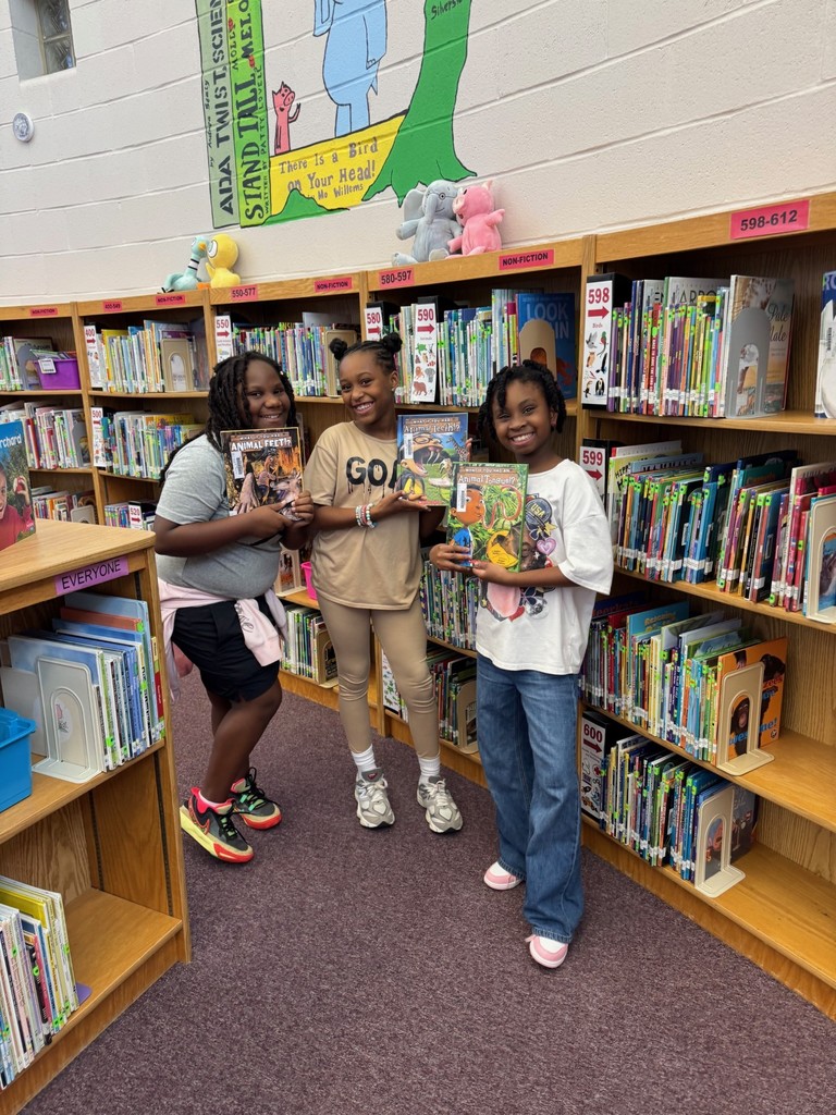 5th Graders Shelving Books
