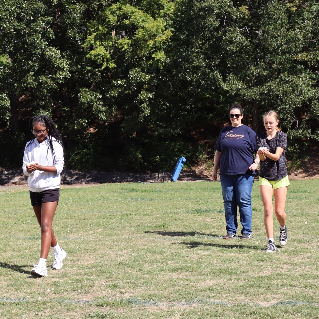 Students holding popcorn  as they participate in the relay.