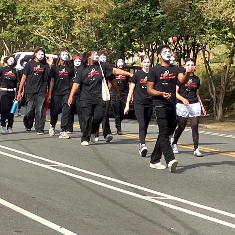 Mimes walking in the street