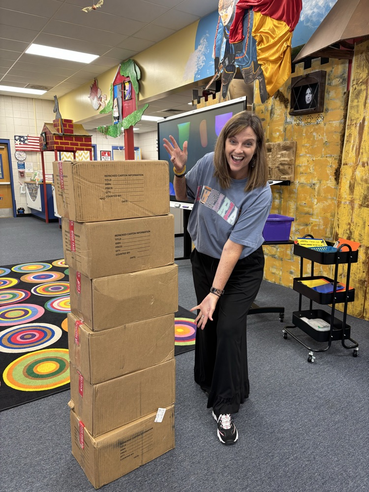 librarian with boxes of books