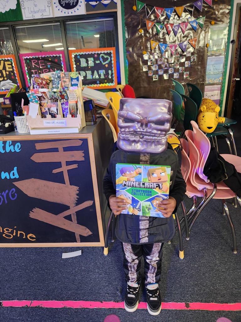 Image of a student wearing a purple mask and minecraft costume for the Book character parade. 
