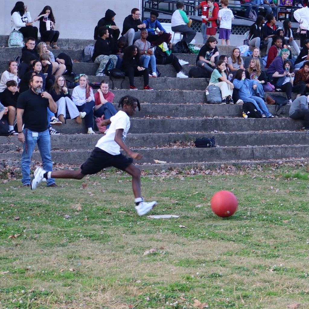 A student kicking the ball