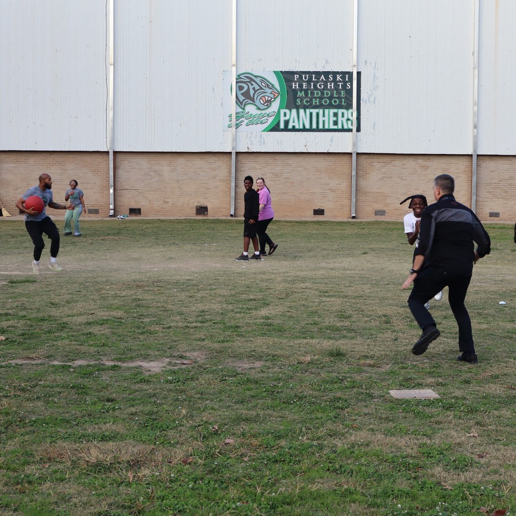 Coach Heath chasing a runner back to first