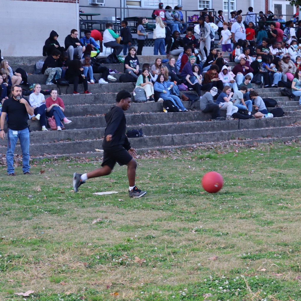 A student kicking the ball