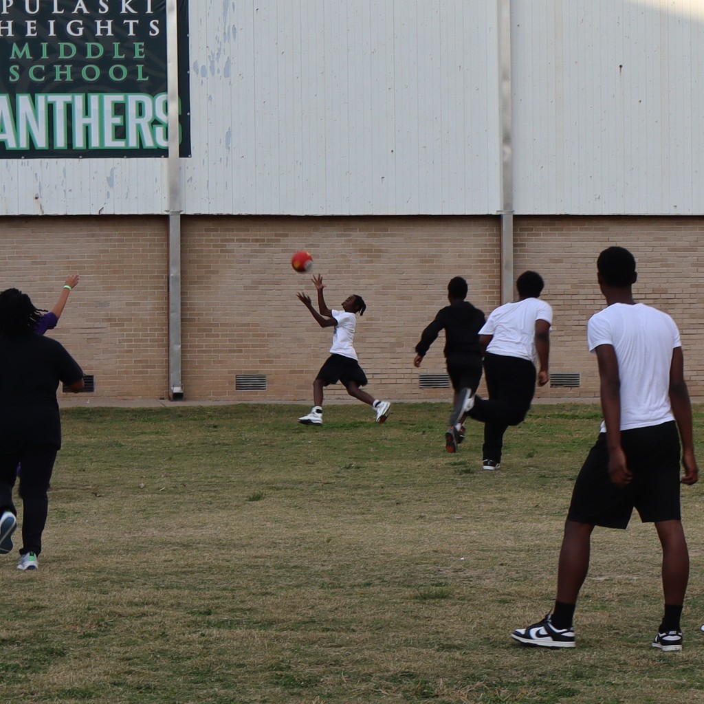 A student going up to make a grab