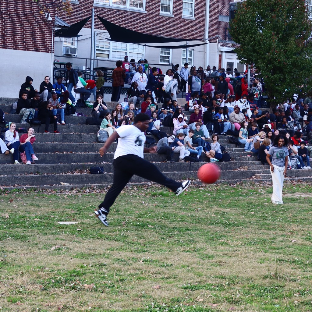 A student kicking the ball