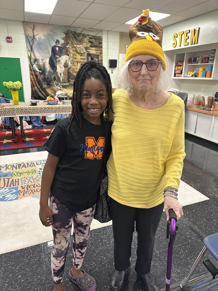 a student greeter and a ViPS volunteer reader 