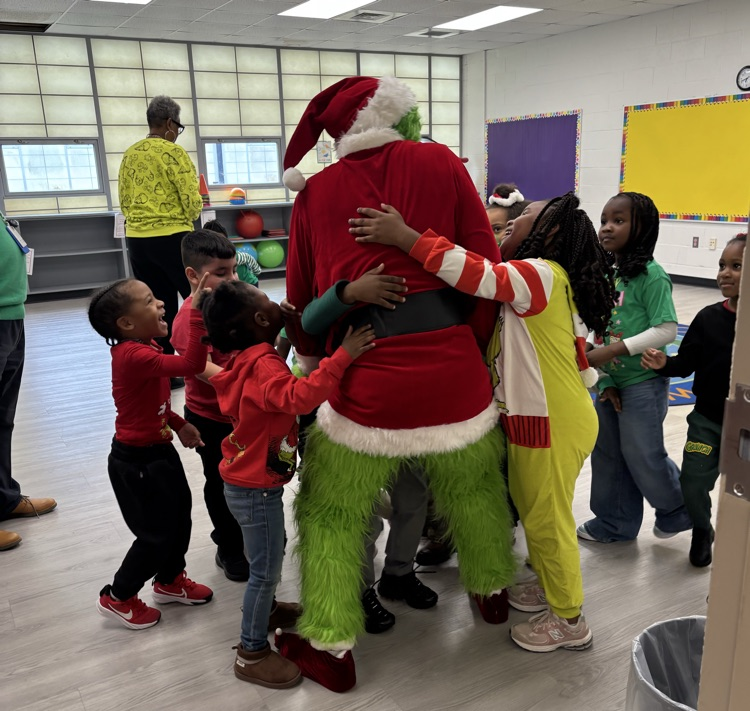 Mr. Grinch receives the gift of hugs!