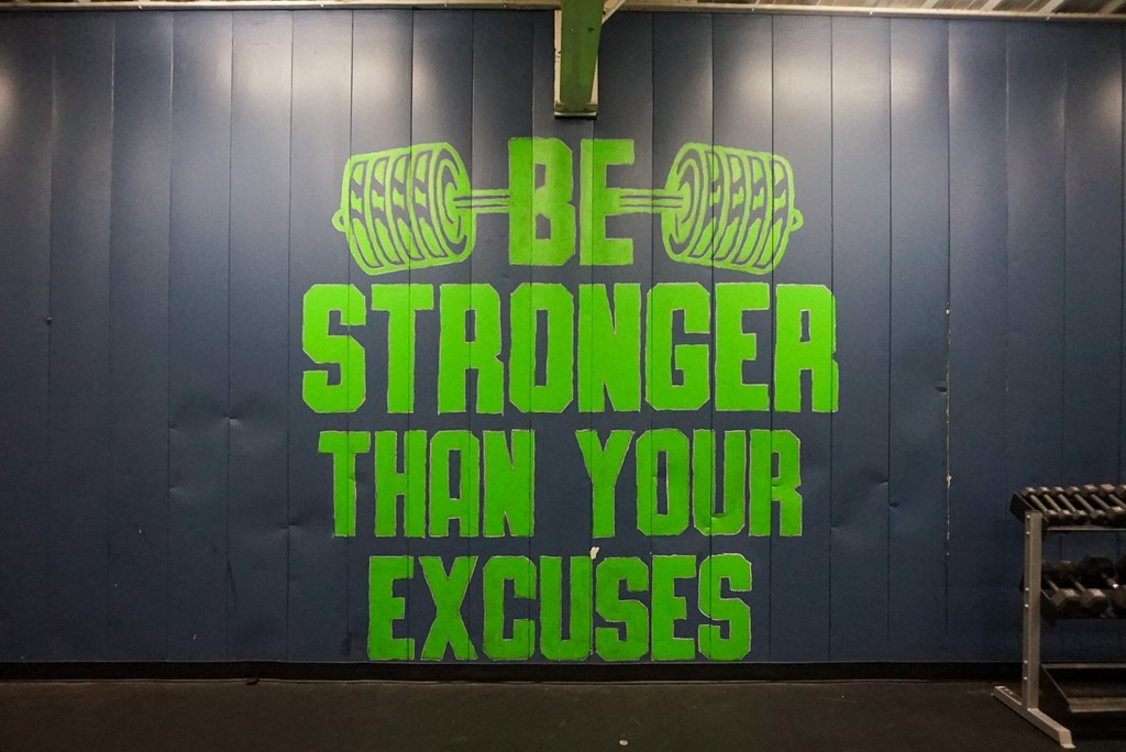 JA Fair K8 Weight Room Mural that says Be Stronger than your Excuses.