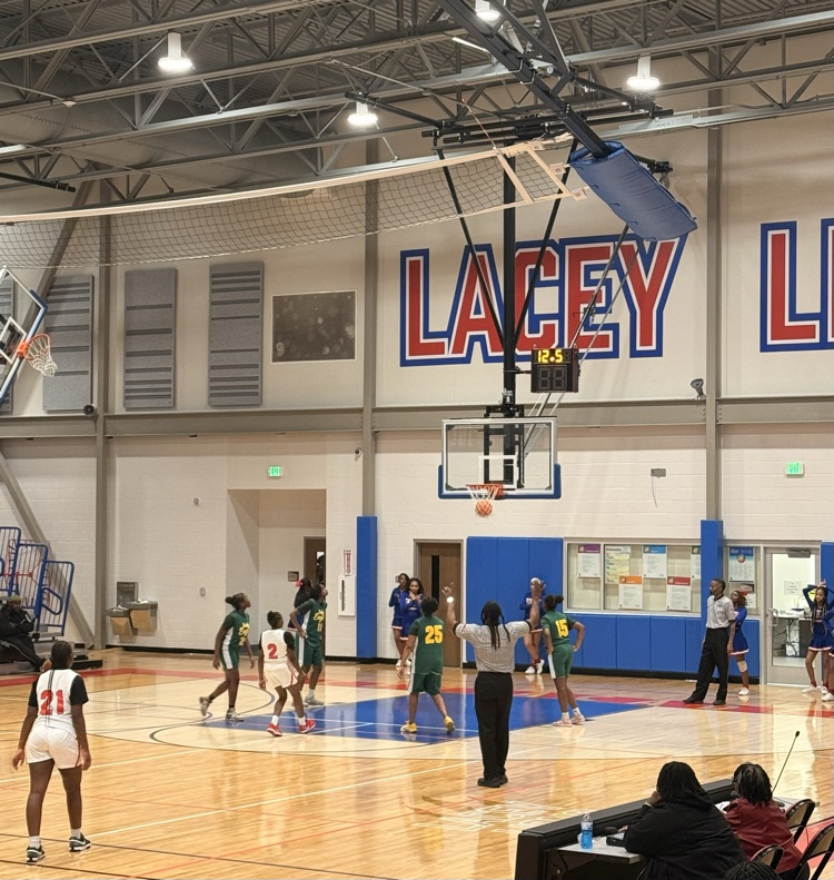 One of our students is shooting a free throw and it goes through the hoop