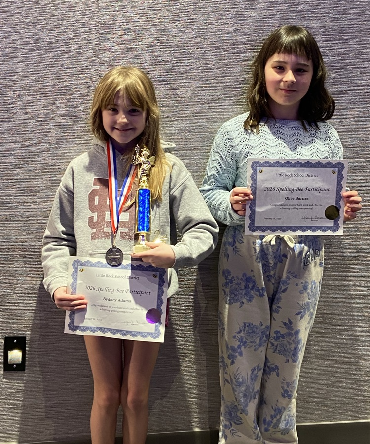 two girls holding certificates