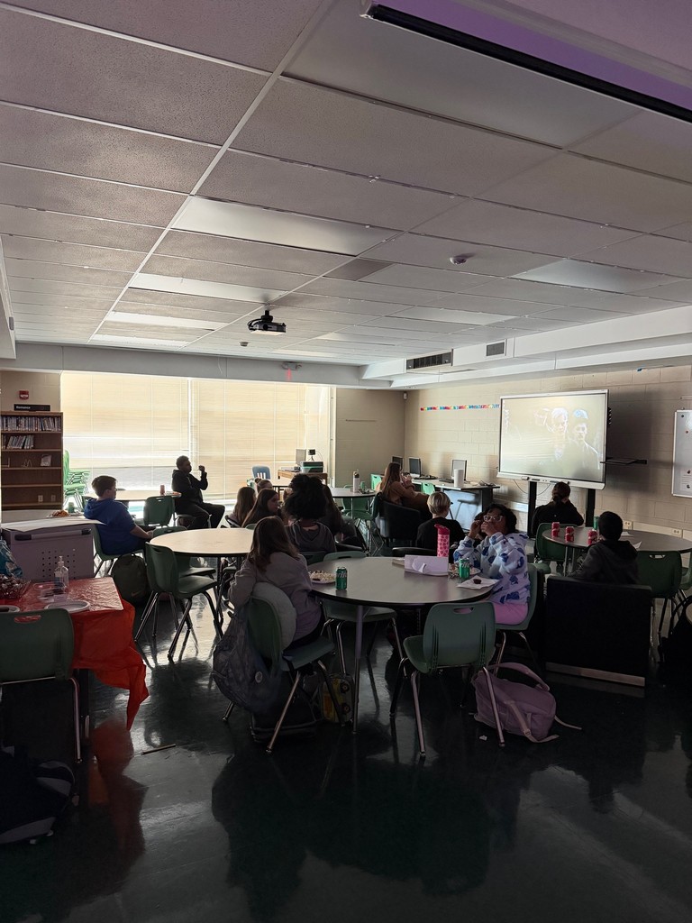 A group of students watching Hunger Games in the Library