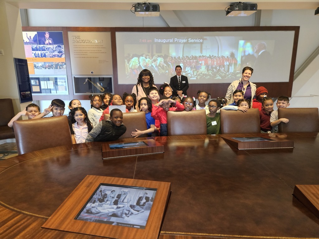 Mrs Owen's class standing by a table from the White House