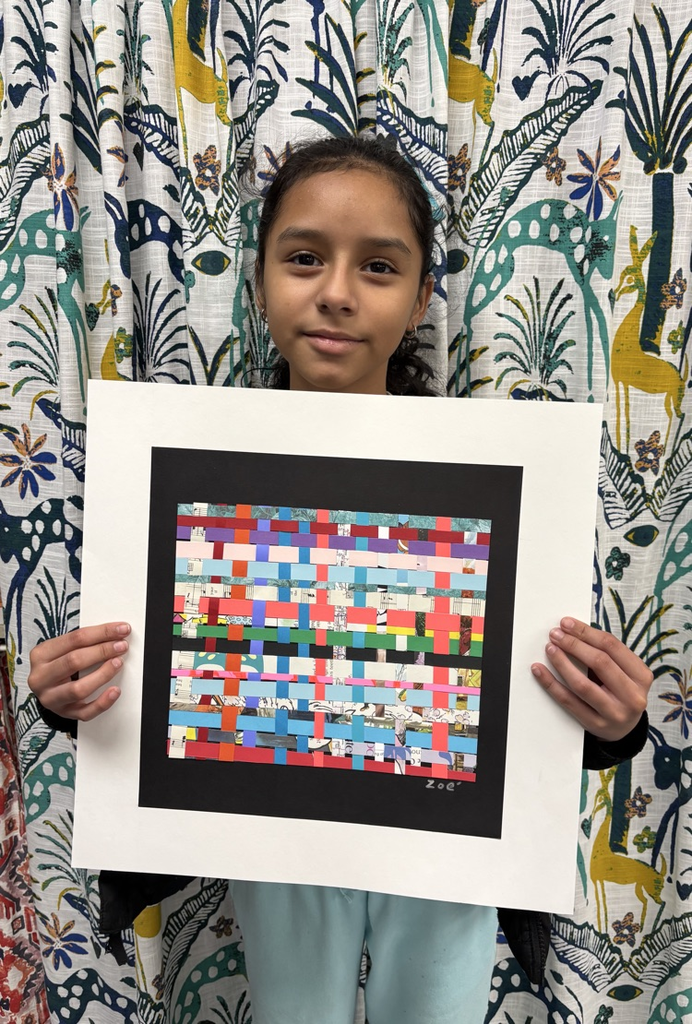 child holding artwork