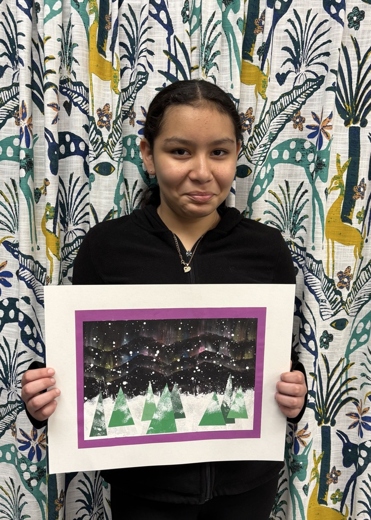 child holding artwork