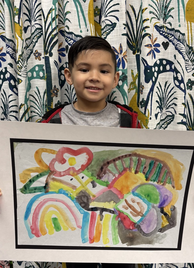 child holding artwork