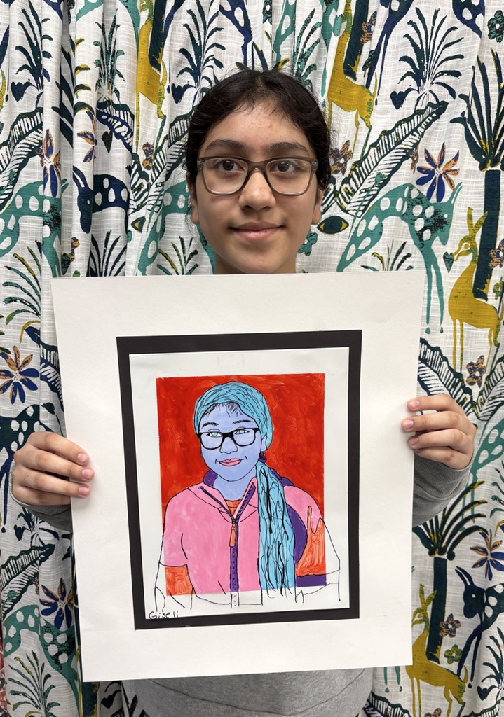 child holding artwork