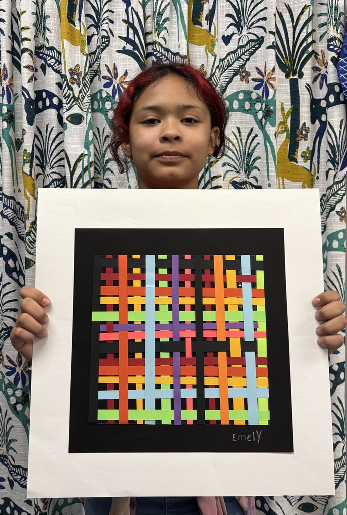child holding artwork