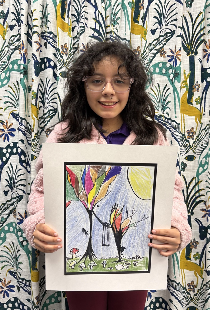 child holding artwork
