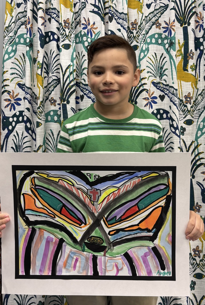 child holding artwork