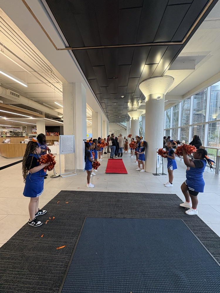 McDermott Cheer team welcomes guests.