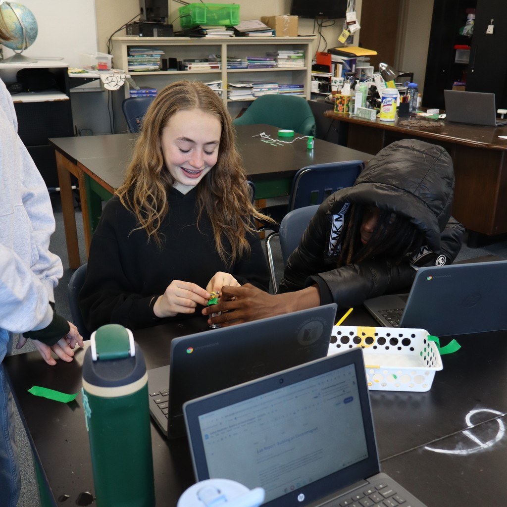 Students conducting an experiment in Science