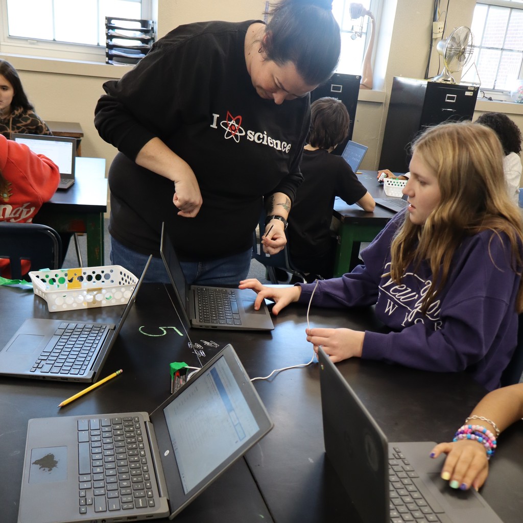 Students conducting an experiment in Science