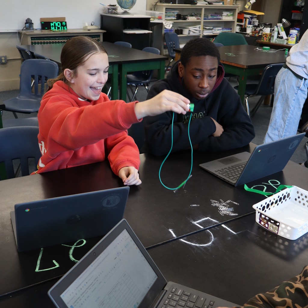 Students conducting an experiment in Science