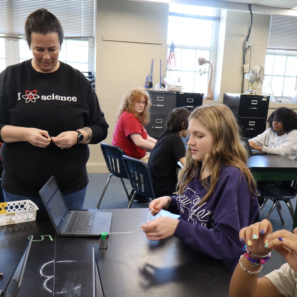 Students conducting an experiment in Science