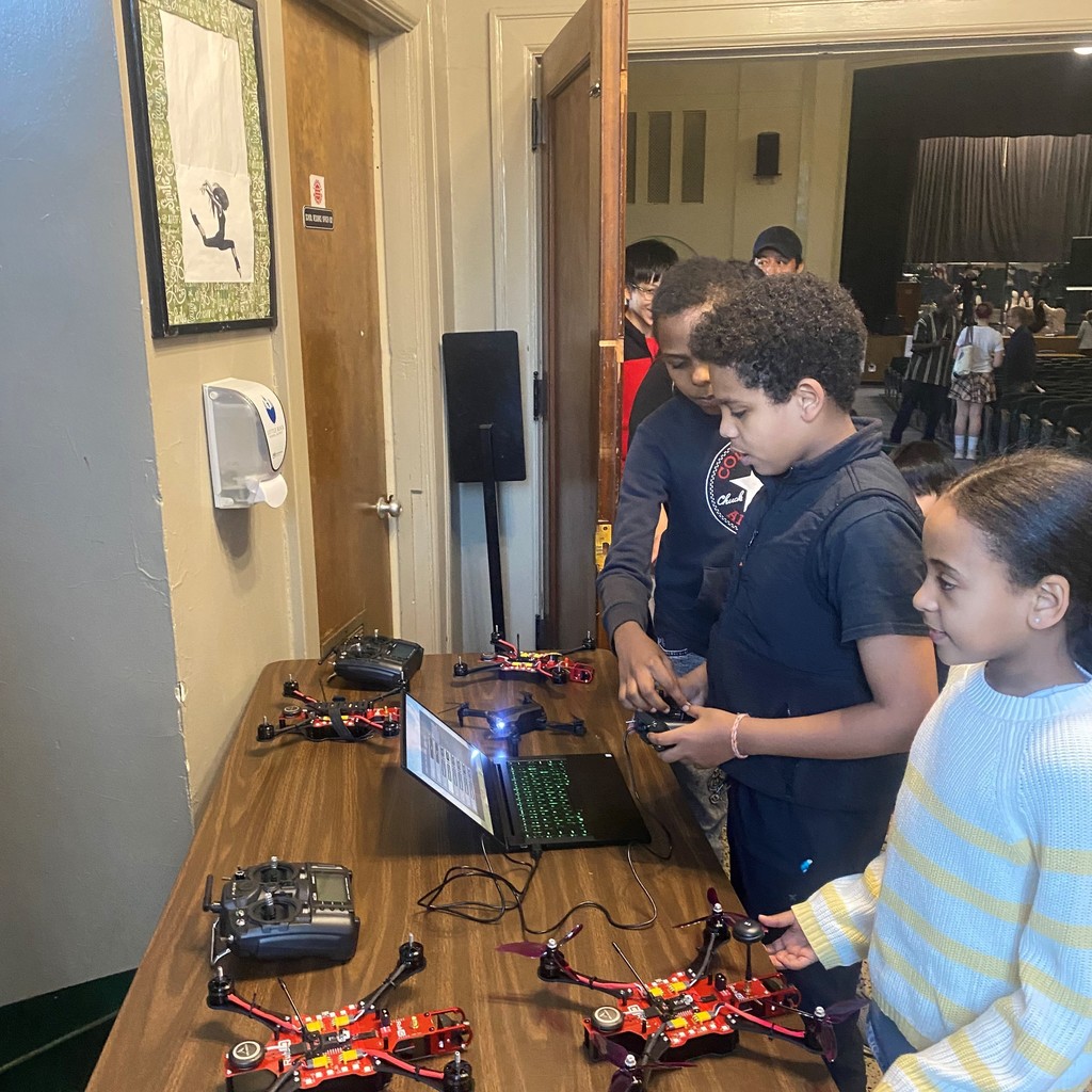 PHMS students looking at drones