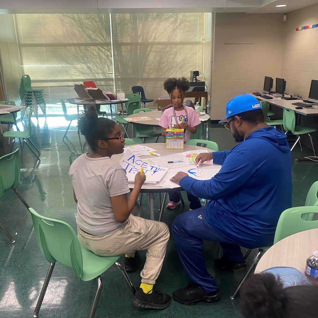 PHMS family making signs for ATLAS testing