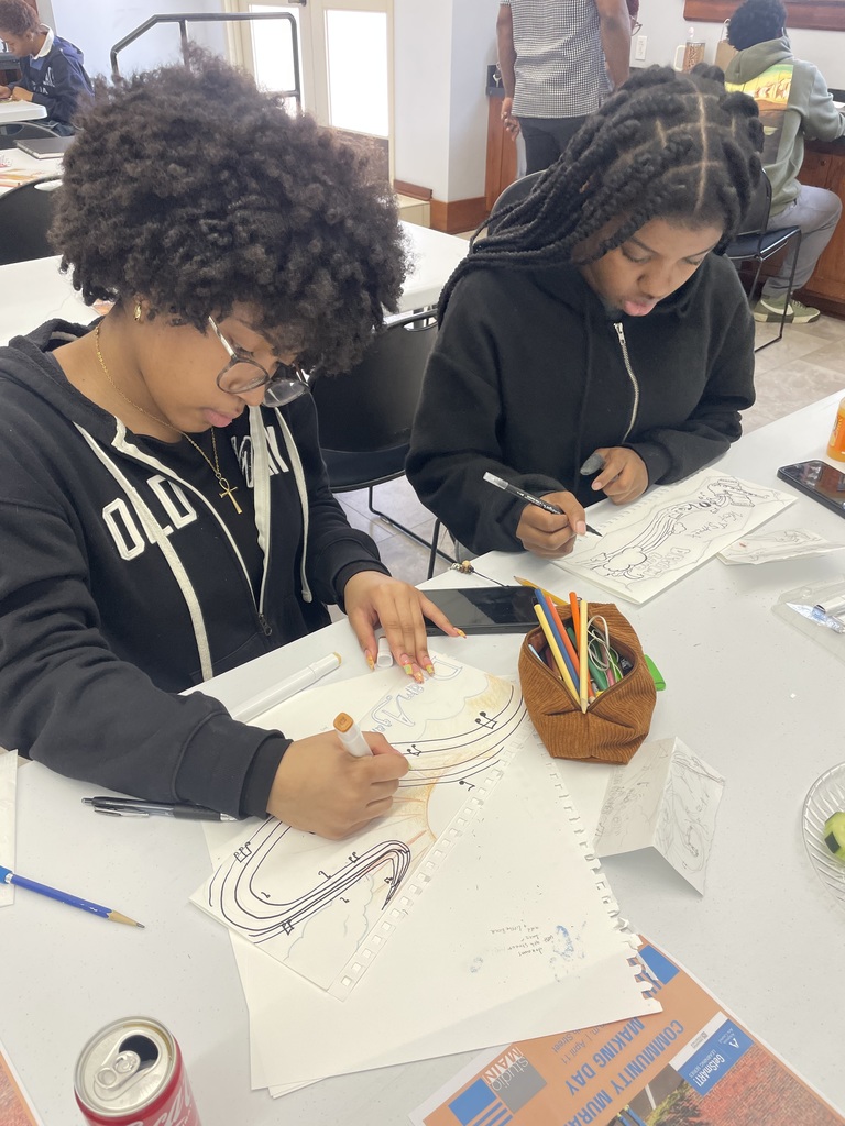 Two students drawing.