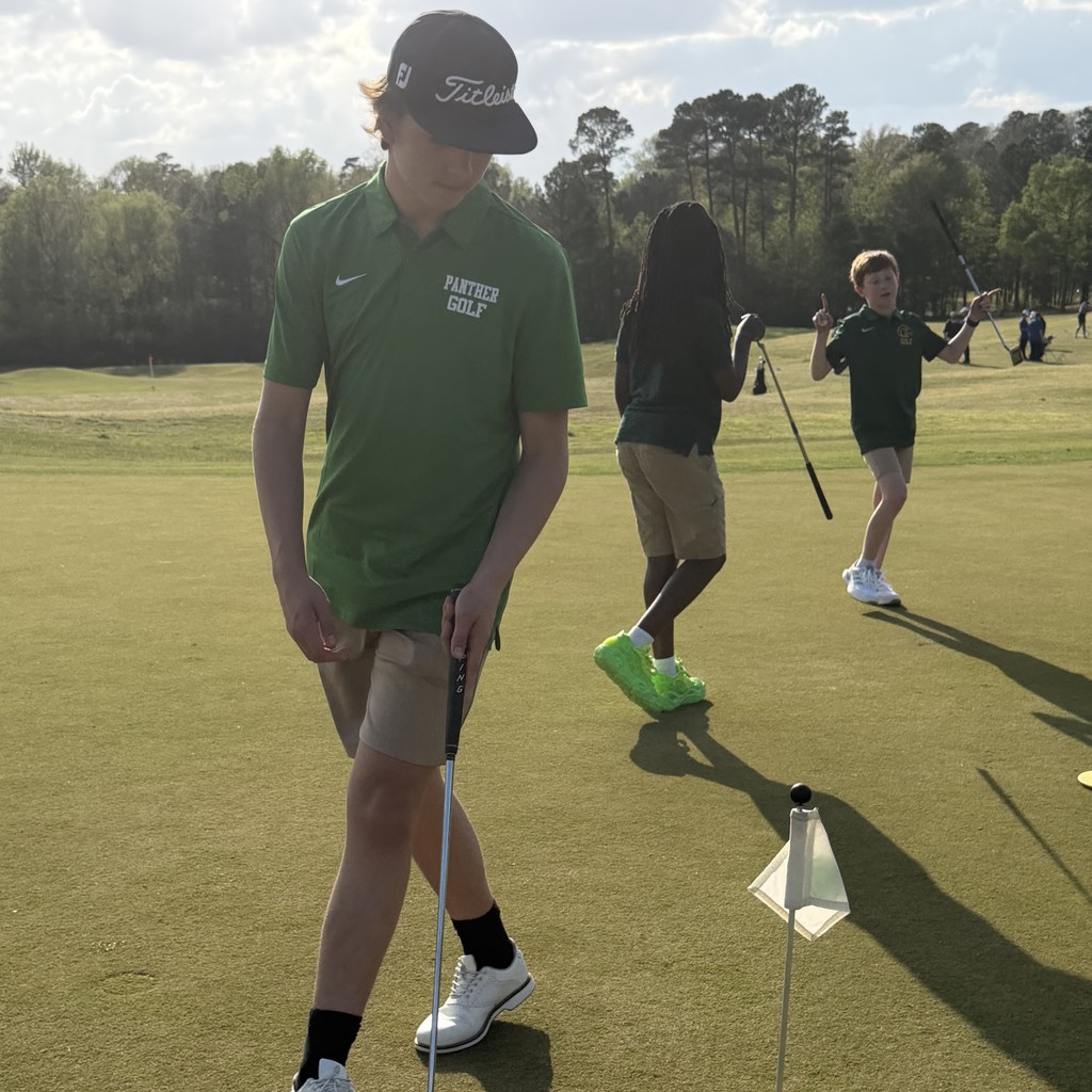 Students playing golf