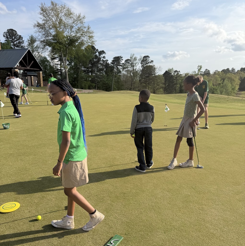 Students learning golf
