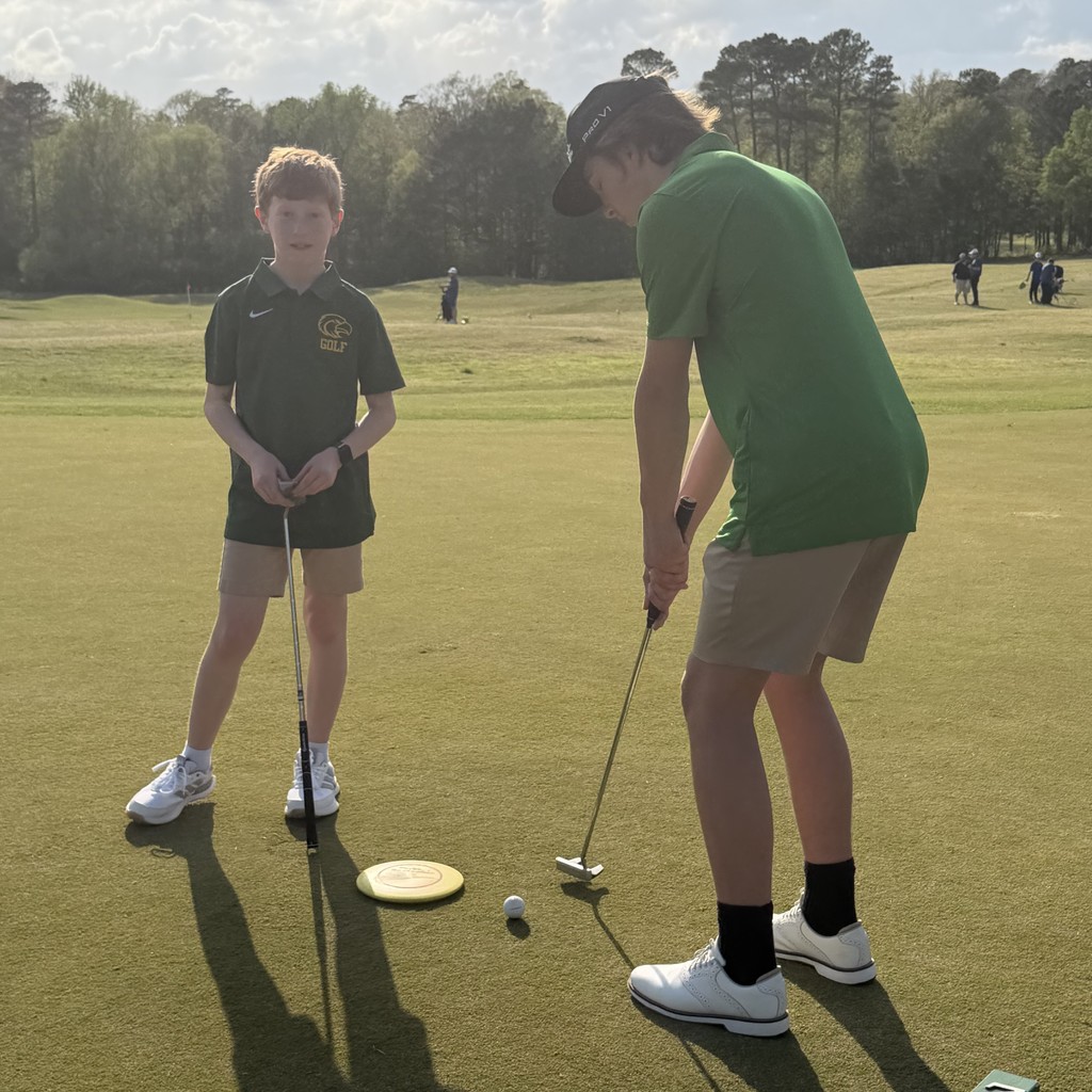 Students learning golf