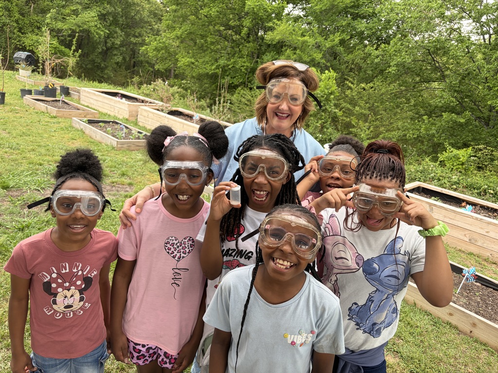 3rd graders and their teacher with saety goggles on