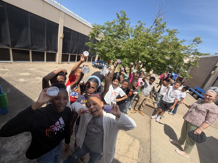 students celebrating their finished slime