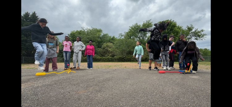 students playing with stomp rockets